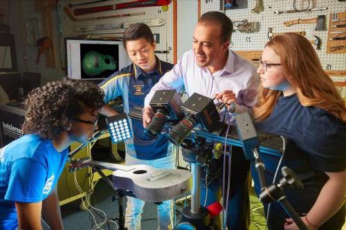 Students work in an acoustics lab.